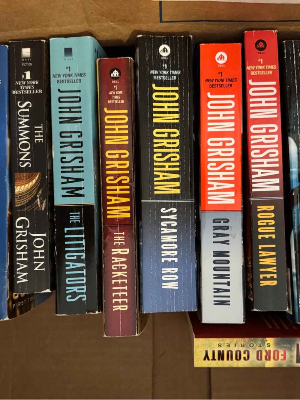 John Grisham Paperback Book Lot - Multi-Color Spines